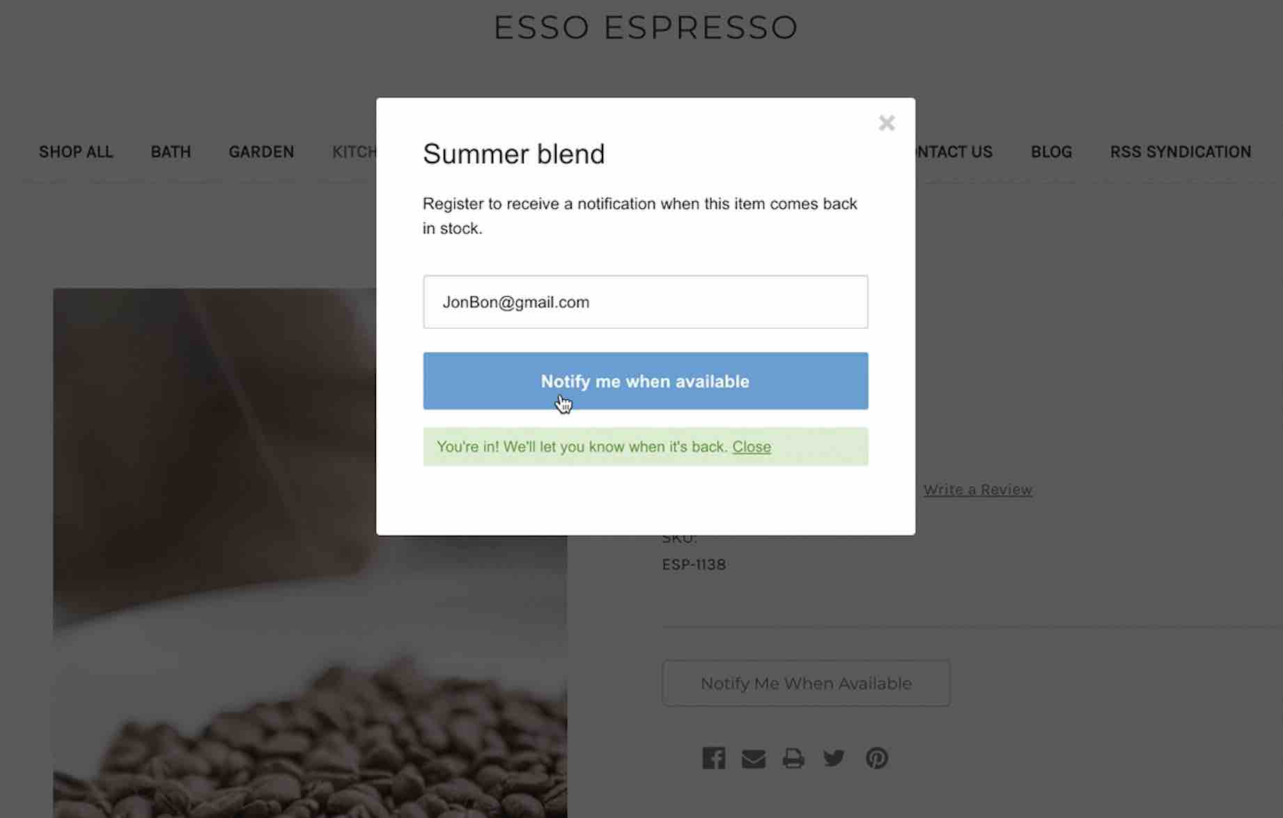 Back in stock popup form on Esso Espresso store with Notify me when available with blue background, and success message highlighted in green