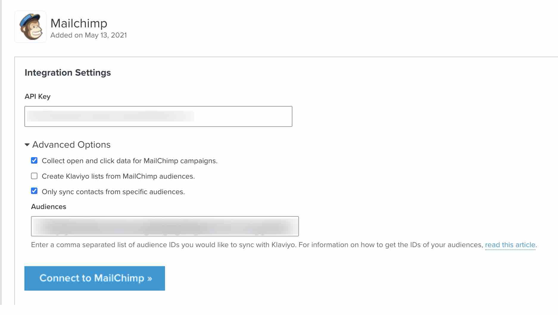 Klaviyo’s Mailchimp integration setup page, with API key from Mailchimp pasted into API key box and first and third checkboxes under Advanced Options selected
