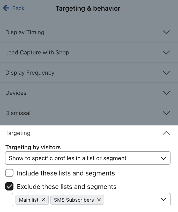 The Targeting by visitors setting for an example form set to Show to specific profiles in a list or segment and exclude those already in a the Main list and SMS list.