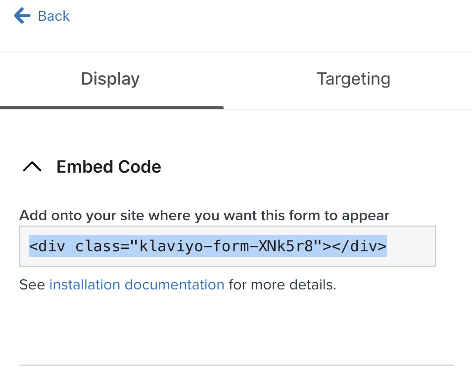 The embed code for an example sign-up form highlighted from the Targeting and behaviors tab of the form editor in Klaviyo.